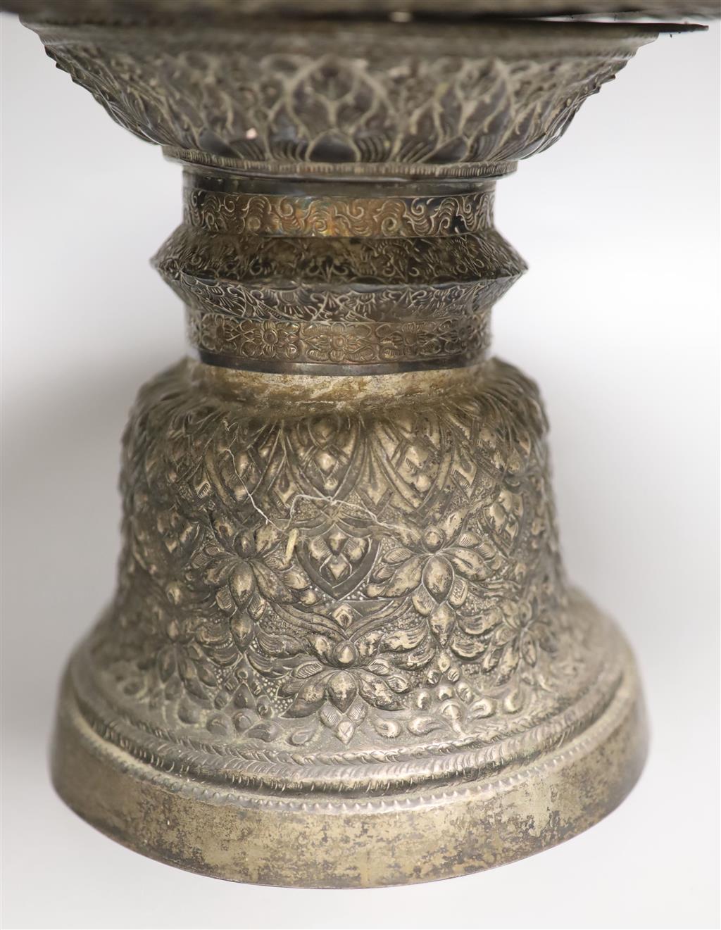 A late 19th/early 20th century Burmese? repousse white metal pedestal bowl(a.f.), height 24cm, gross 29.5oz.